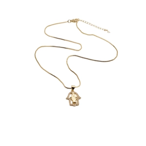 Gold-plated Hamsa hand necklace with zircon pendant on a white background