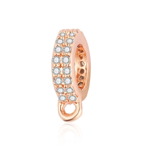 Macro detail of rose gold bail with sparkling cubic zirconia for jewelry making