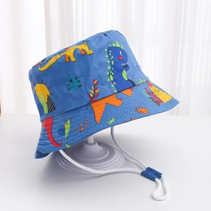 Detail of blue kids sun hat featuring colorful dinosaur prints and windproof drawstring