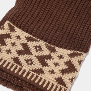 Close-up of winter knitted scarf with brown geometric jacquard pattern and waffle texture