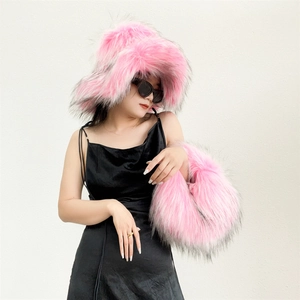 Close-up of bright pink faux fur hat and handbag set with stylish black tips for Y2K look