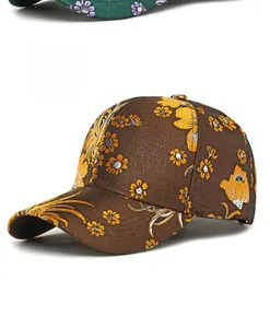 Detailed close-up of a brown baseball cap featuring yellow floral embroidery patterns