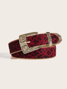 Close-up of red leopard print belt featuring ornate gold buckle and gold beaded edges