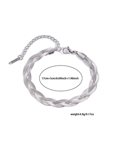 Detailed macro of a silver-toned braided stainless steel bracelet with a lobster clasp
