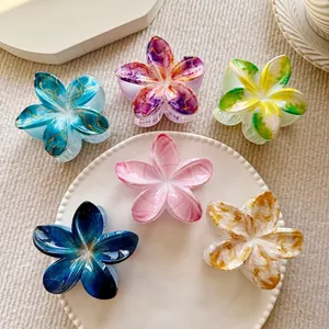 Set of six marble texture frangipani hair claw clips in various elegant colors
