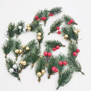 Artificial Christmas pine needles and berries decor in red, gold and silver mix
