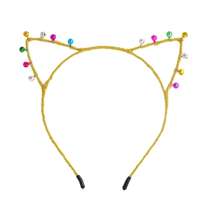 Detail of cat ear headband with shiny gold fabric and colorful jingle bells ornament