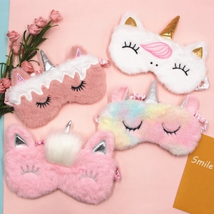 Set of four colorful plush unicorn sleep masks with soft fur and embroidered lashes