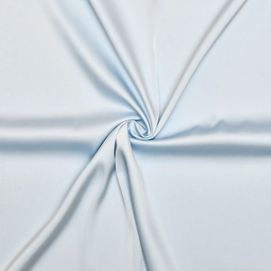 Detailed close-up of light blue satin fabric showing smooth texture and soft silk sheen
