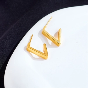 Minimalist gold V-shaped geometric earrings in titanium steel with a sleek matte finish