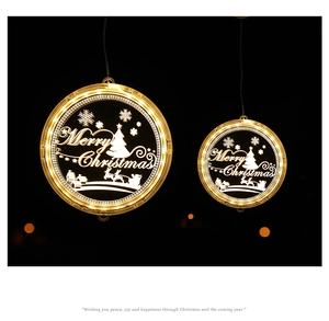 Detail of warm white LED Christmas elk light with Merry Christmas engraving on acrylic