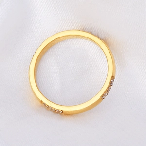 Minimalist 18K gold plated titanium steel ring with twelve inlaid stones on silk
