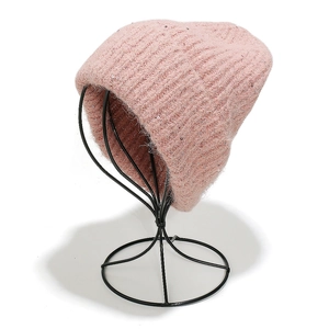 Close-up of pink wool blend knit beanie featuring delicate sequins and plush fuzzy texture