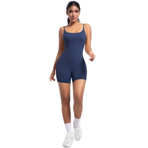 Detailed front view of navy blue yoga romper with slim straps and high-stretch fabric