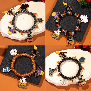 Detailed grid of Halloween beaded bracelets with pumpkin, ghost, and bat charms
