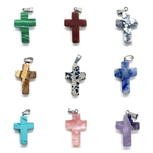 Set of nine colorful natural stone cross pendants with metal bails on a clean white background