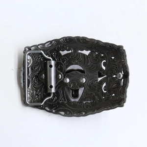 Detailed view of western bull skull belt buckle with intricate vintage floral carvings