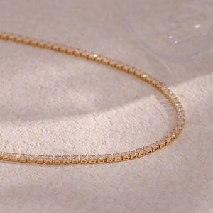 Detail of 14K gold plated tennis chain with sparkling micro-pave cubic zirconia crystals