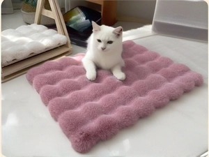 Close-up of pink plush pet mat with wave texture and soft faux rabbit fur for cats