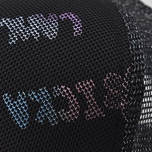 Detail of breathable black mesh cap with colorful gradient VISION lettering print