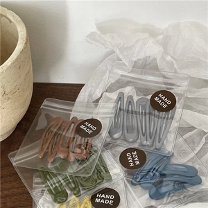 Matte colorful teardrop BB hair clip set in various earth tones and handmade packaging