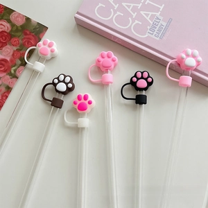 Macro view of cute silicone cat paw straw covers in various colors for 10mm tumblers