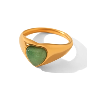 Detail of a vintage heart-shaped green natural stone set in a gold stainless steel band