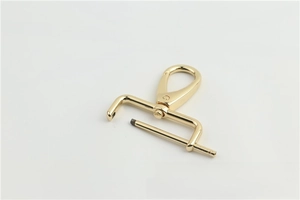 Detail view of light gold swivel lobster clasp with screw-in bar for bag straps