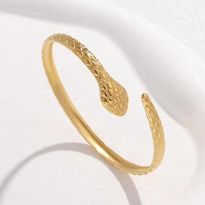 Snake embossed gold open cuff bracelet in minimalist stainless steel for women