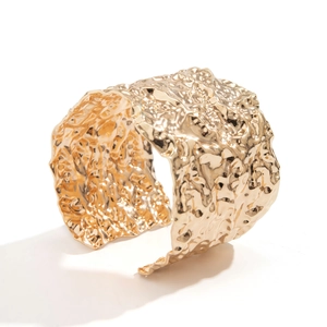 Gold wide cuff bracelet with hammered metal texture and irregular open punk design