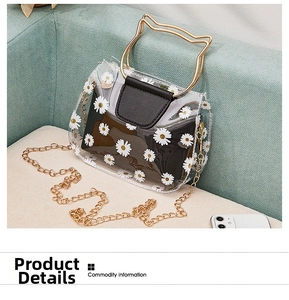 Close-up of daisy print transparent PVC bag with cat-ear metal handle and chain strap