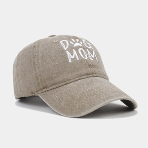 Close-up of Dog Mom embroidery on washed cotton baseball cap with vintage finish