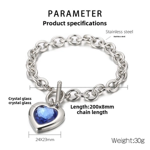 Detail of silver stainless steel heart bracelet with blue crystal and toggle clasp