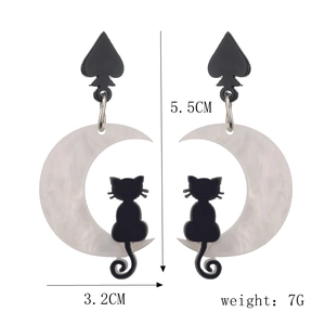 Detail view of black and white cat moon earrings with dimensions 5.5cm height and 3.2cm width