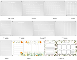 Flat lay of thirteen acrylic magnetic weekly planners and calendars with diverse designs
