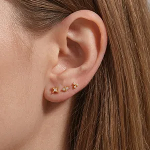 Set of three S925 sterling silver gold stud earrings with cubic zirconia and geometric shapes