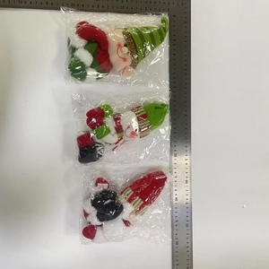 Three-piece set of plush Christmas characters including Santa and snowman in plastic bags