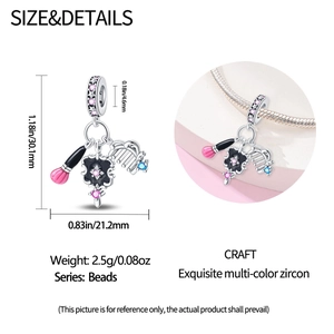 Detail of makeup theme charm with brush, comb and compact in 925 silver and zircons