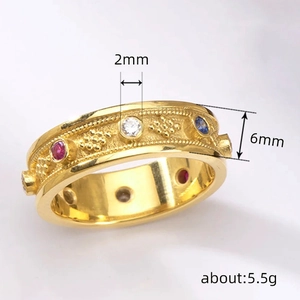 Vintage gold ring with colorful zircon inlay and 6mm band width showing filigree detail