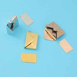Detailed view of DIY envelope locket pendants in silver, gold, and rose gold finishes
