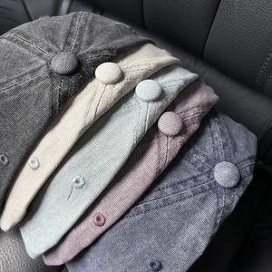 Detail of vintage washed canvas baseball caps with premium embroidery and textured finish