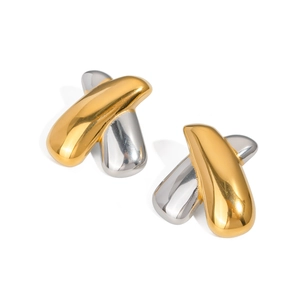Macro detail of high-polish X-shaped two-tone gold and silver stainless steel earrings