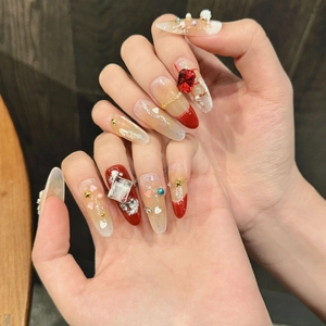 Handmade red and gold 3D Christmas press-on nails with rhinestones and star charms