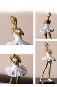 Detailed close-up showing the elegant golden finish and white tutu of the ballet girl statue