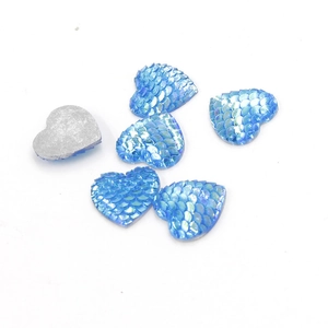 Detail of 16mm blue heart resin charms with mermaid scale texture and flat silver back