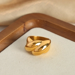Polished gold twisted rope croissant dome ring made of minimalist titanium steel