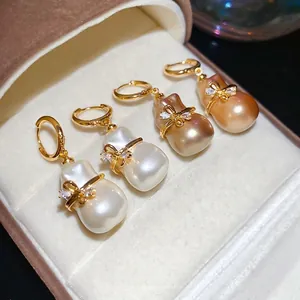 Boucles d'oreilles perles baroques plaquées or 18k avec nœuds sertis de cristaux