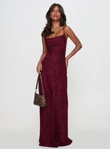 Detailed close-up of dark red lace texture on an elegant bodycon backless maxi dress