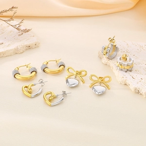 Elegant gold and silver heart-shaped stainless steel earrings in various geometric styles