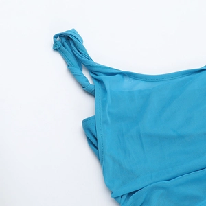 Detailed close-up of blue mesh stitching and fabric texture on a one-shoulder dress